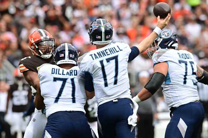 Tennessee Titans quarterback Ryan Tannehill (17) throws a pass over the defense of Cleveland Browns defensive end Myles Garrett (95) during the first half at Cleveland Browns Stadium.